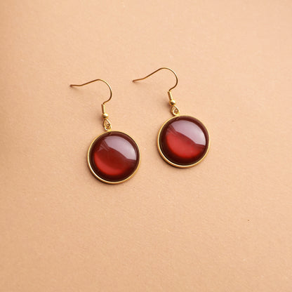 Ohrringe in Gold mit rundem braunen Stein aus Edelstahl (2 cm)