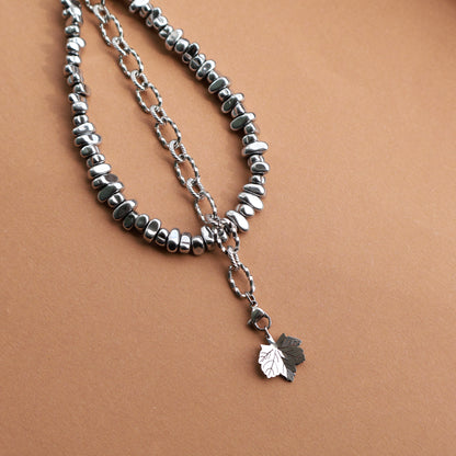 Taschenanhänger aus Edelstahl und Hämatitperlen in Silber mit mit 2 wechselbaren Anhängern