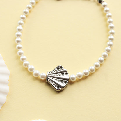 Perlenarmband mit Muschelkernperlen und Muschel Motiv, Edelstahl